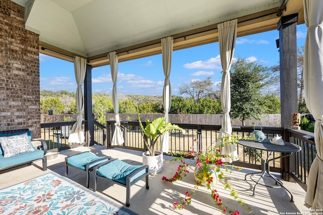 sunroom / solarium with lofted ceiling