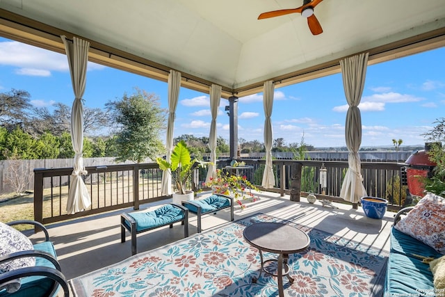 exterior space with ceiling fan