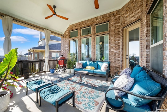 view of patio / terrace featuring ceiling fan and an outdoor living space