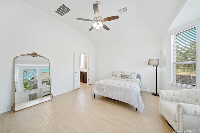 unfurnished bedroom with ceiling fan, light hardwood / wood-style flooring, ensuite bathroom, and lofted ceiling