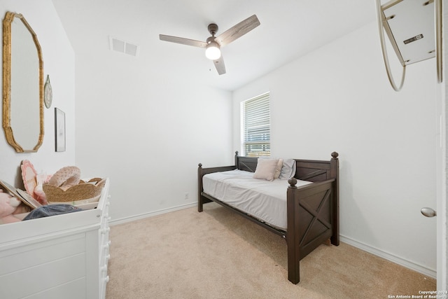 carpeted bedroom featuring ceiling fan