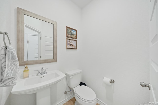 bathroom with toilet and sink