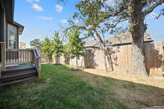 view of yard with a wooden deck