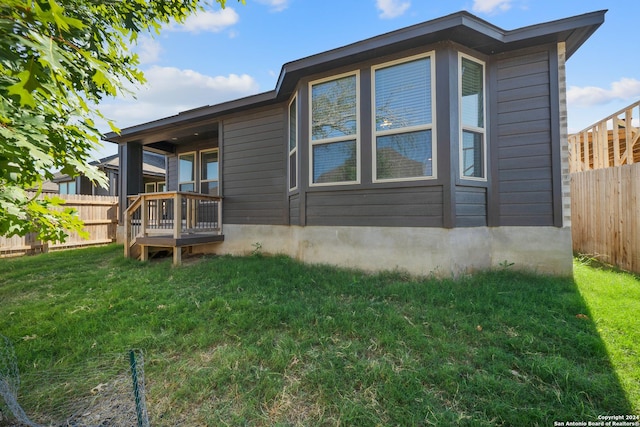 rear view of house with a yard