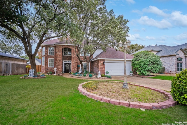 view of front of house featuring a garage and a front lawn