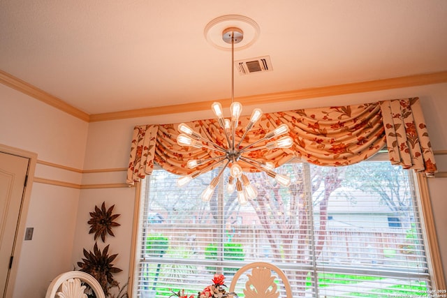 room details with an inviting chandelier and ornamental molding