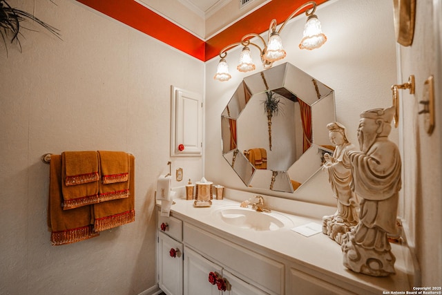 bathroom featuring ornamental molding and vanity