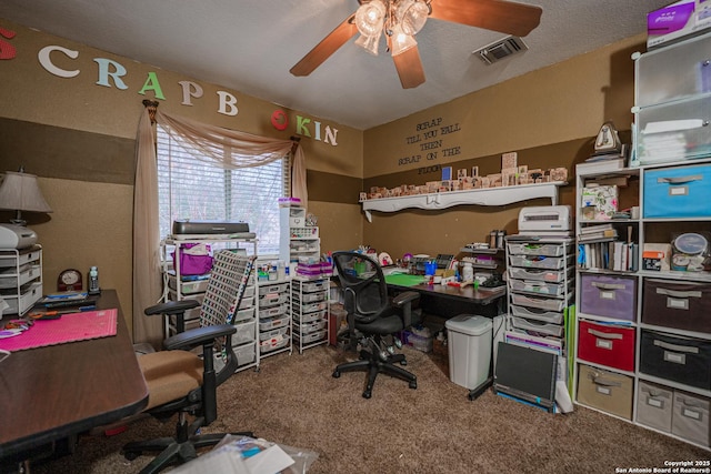 office area with ceiling fan, carpet floors, and a textured ceiling