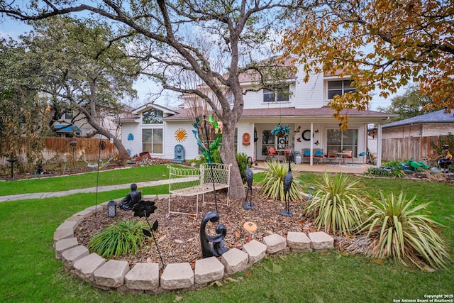 view of front of house with a front lawn and covered porch