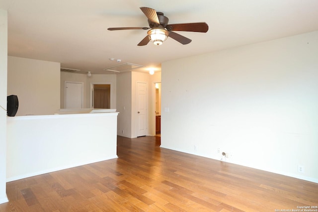 unfurnished room featuring ceiling fan and hardwood / wood-style flooring