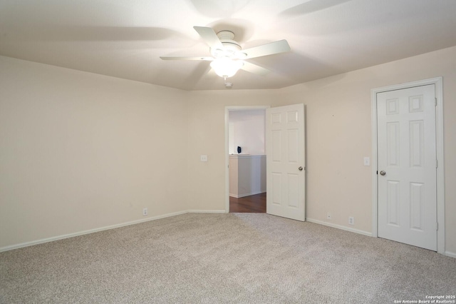 unfurnished bedroom with ceiling fan and carpet flooring