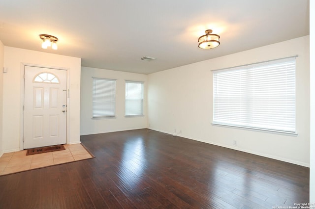 entrance foyer with dark hardwood / wood-style flooring