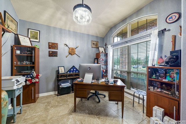 office featuring an inviting chandelier and vaulted ceiling