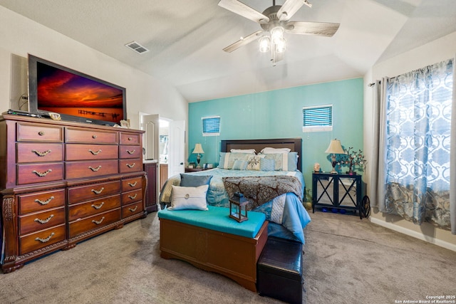 bedroom featuring light carpet, ceiling fan, and vaulted ceiling