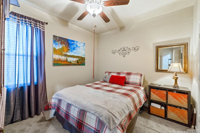 bedroom featuring ceiling fan and light colored carpet