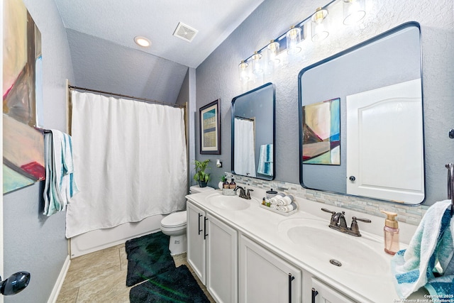 full bathroom featuring lofted ceiling, toilet, decorative backsplash, shower / bath combination with curtain, and vanity