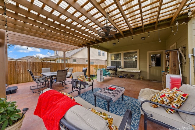 view of patio with a fire pit and a pergola