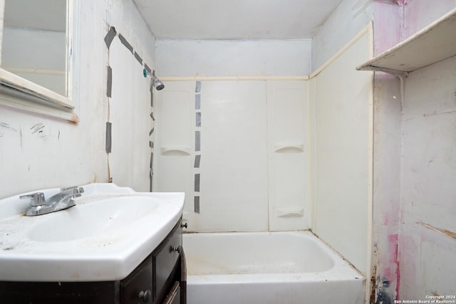 bathroom featuring bathing tub / shower combination and vanity