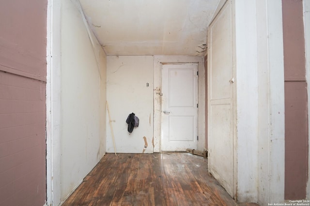 corridor with dark hardwood / wood-style floors