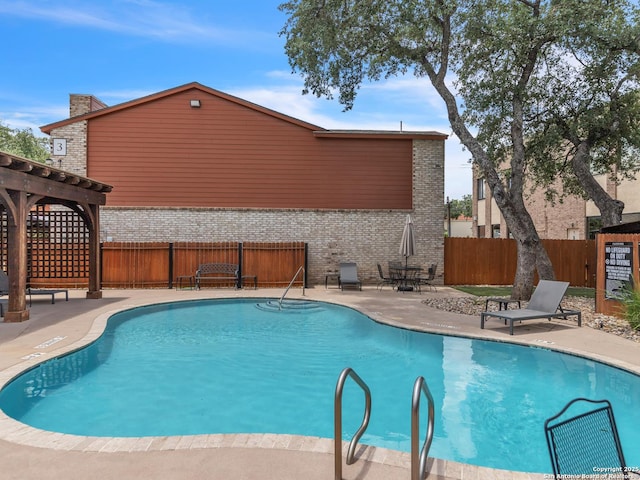 view of swimming pool with a patio area