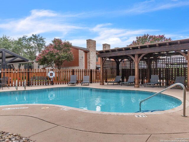 view of swimming pool with a patio area