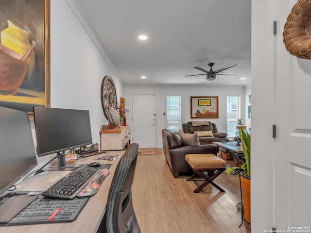 office area featuring light wood-type flooring, ceiling fan, and ornamental molding