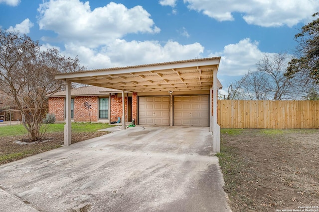 view of front of house featuring a garage and a carport