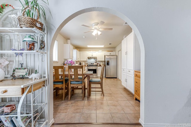 dining area featuring light tile patterned flooring and ceiling fan