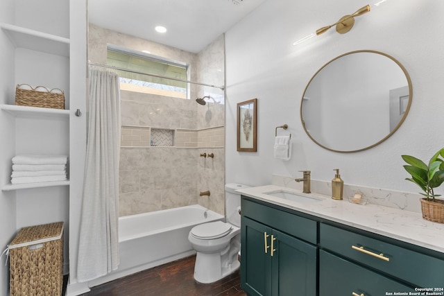 full bathroom with hardwood / wood-style flooring, toilet, vanity, and shower / bath combo