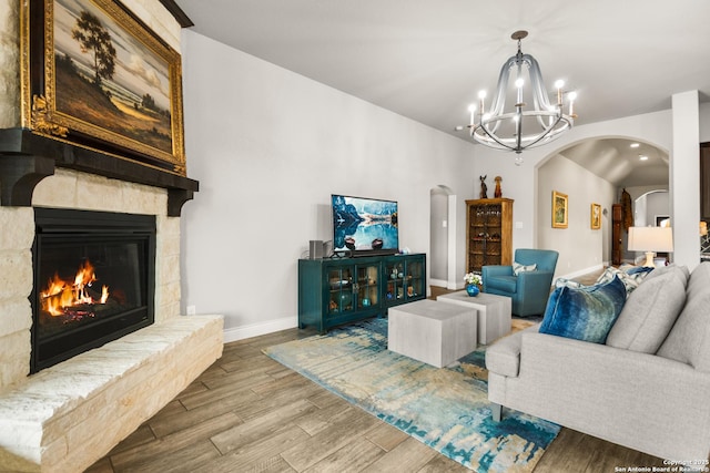 living room with a fireplace and a chandelier