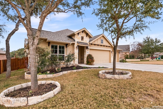 view of front facade with a front yard and a garage