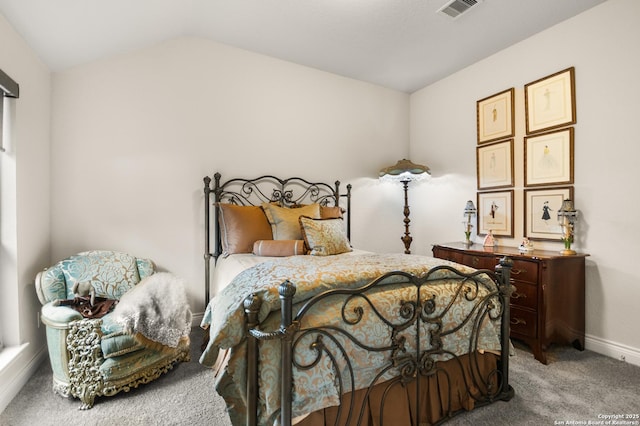 bedroom featuring lofted ceiling and carpet flooring