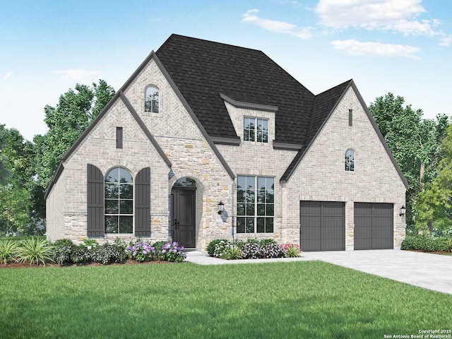 view of front of home with a front lawn and a garage