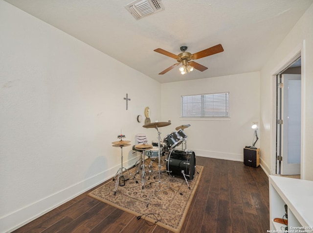 interior space with ceiling fan and dark hardwood / wood-style floors