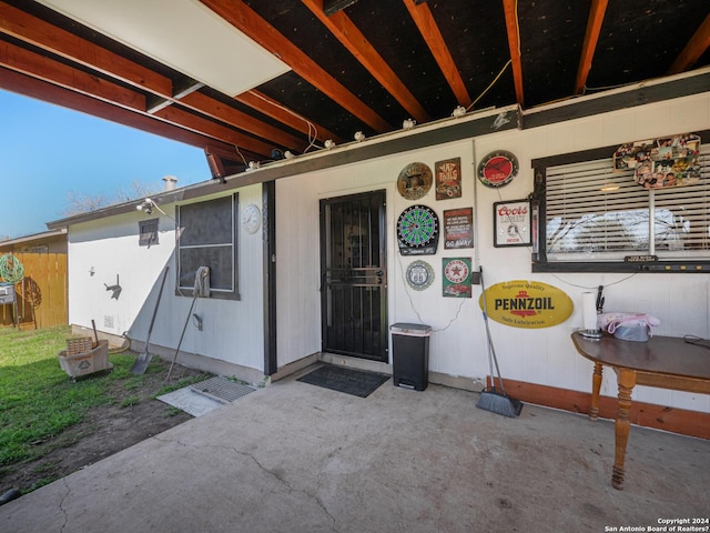 property entrance featuring a patio area