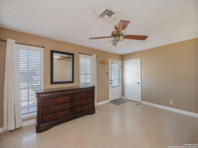 entryway featuring a textured ceiling