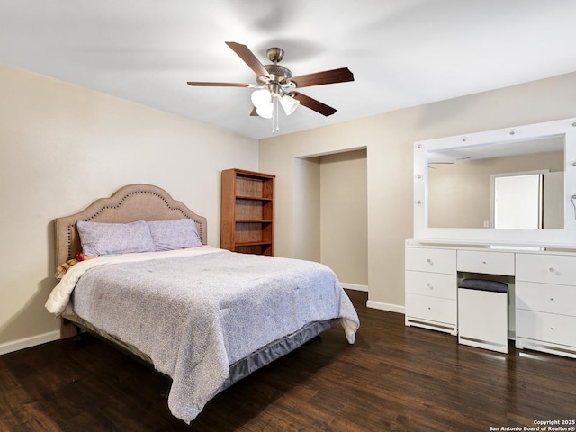 bedroom with ceiling fan and dark wood-type flooring