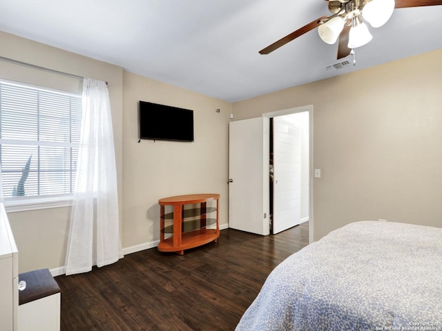 bedroom featuring ceiling fan and dark hardwood / wood-style floors