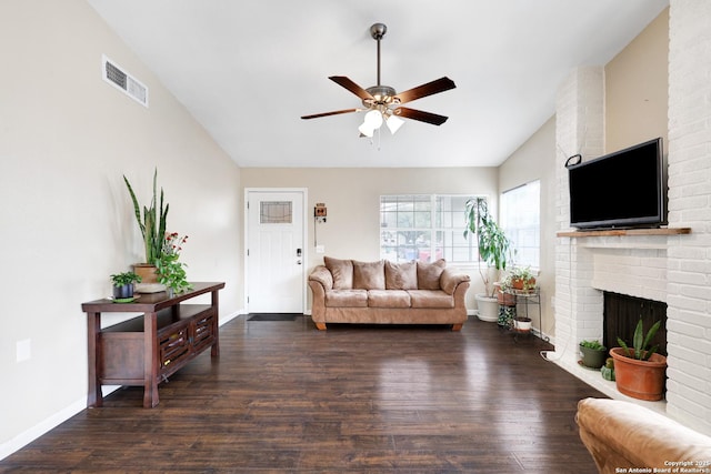 living room with a fireplace, ceiling fan, and dark hardwood / wood-style floors