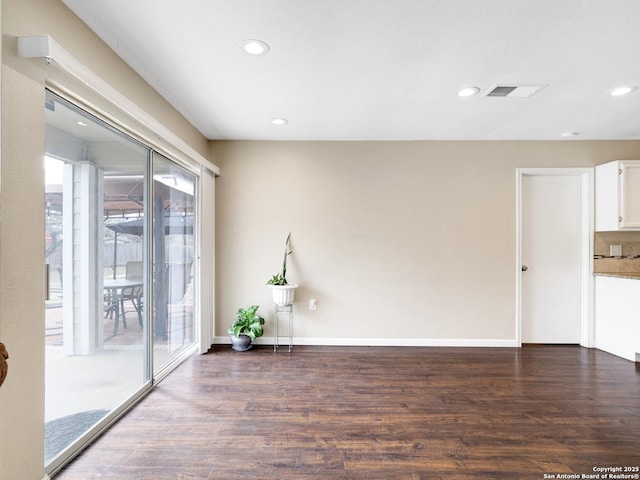 empty room featuring dark hardwood / wood-style floors