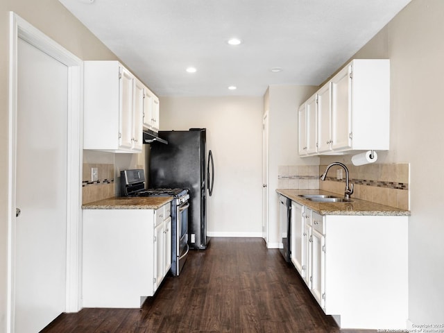 kitchen with stainless steel appliances, white cabinets, sink, and dark hardwood / wood-style floors