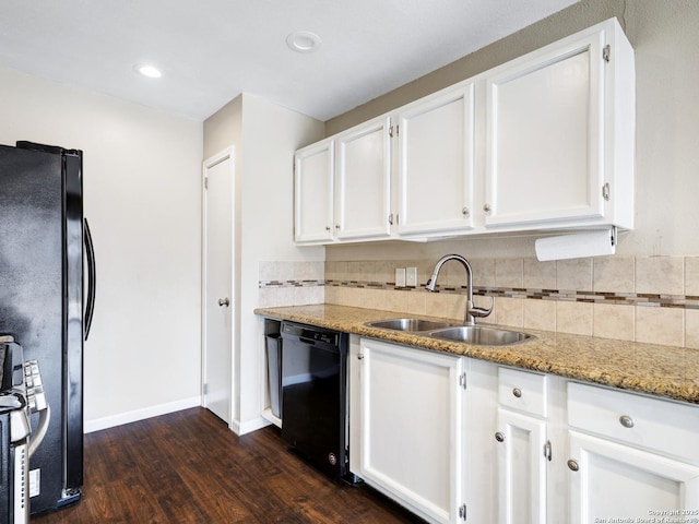 kitchen featuring black appliances, light stone countertops, dark wood-type flooring, sink, and white cabinetry