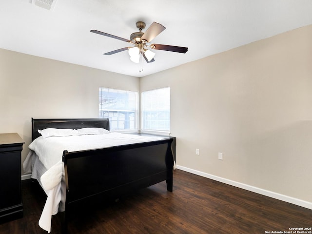 bedroom featuring ceiling fan and dark hardwood / wood-style flooring