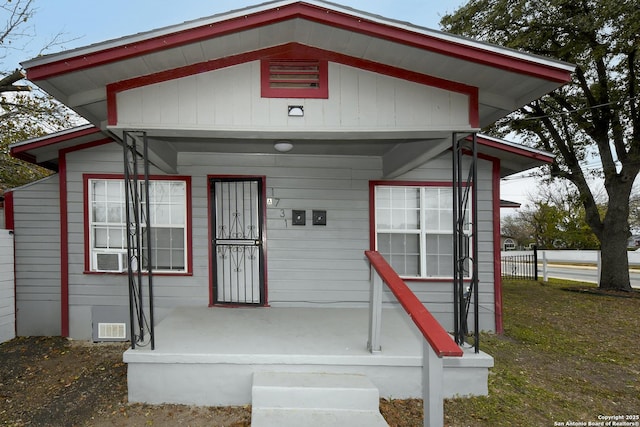 view of front facade with covered porch and crawl space