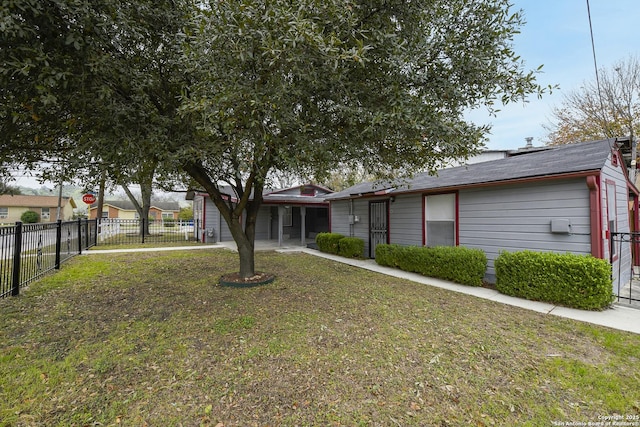 ranch-style house with a front lawn