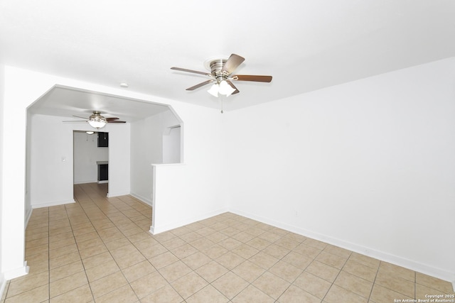 unfurnished room featuring ceiling fan and light tile patterned floors