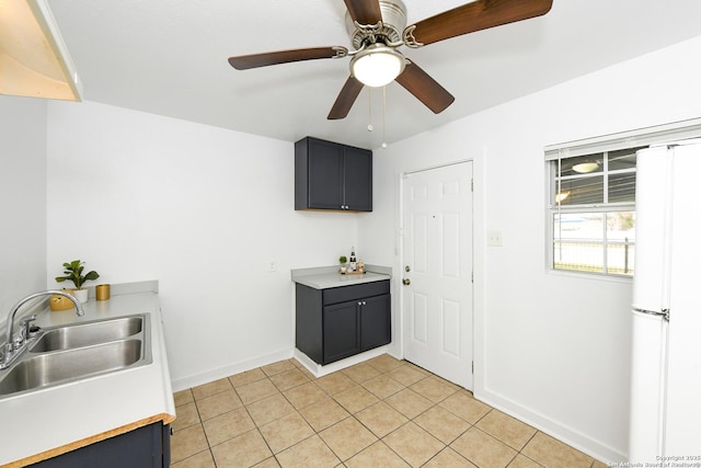 kitchen with sink, ceiling fan, white fridge, and light tile patterned floors