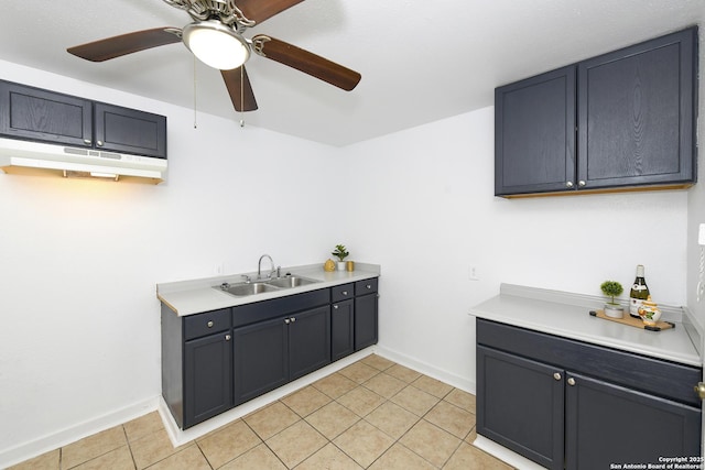 kitchen featuring ceiling fan, light tile patterned flooring, and sink