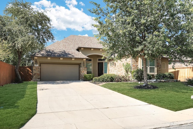 view of front of house with a front lawn and a garage