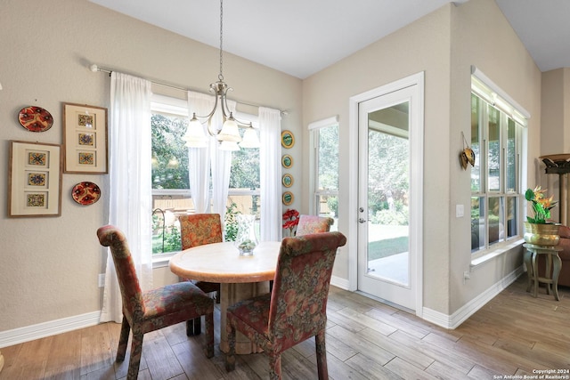 dining space featuring a chandelier and a healthy amount of sunlight